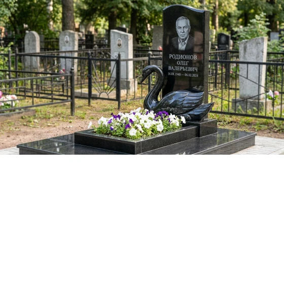Памятник с лебедем из черного габбро-диабаза с глубокой резьбой