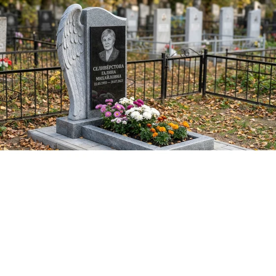 памятник с крылом ангела из серого гранита с портретом